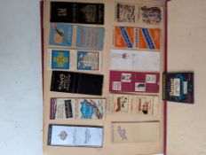 An assortment of vintage match books, mainly American, in album and some loose