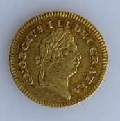An 1803 George III 1/3 Guinea gold coin, 17mm diameter, 2.8g, 0.967 gold