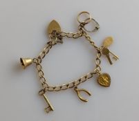 A 9ct gold charm bracelet, links and charms all hallmarked, 15.8g