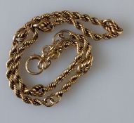 A part rope-twist watch chain, stamped 15ct with 9ct gold clasp, 35 cm, 27g