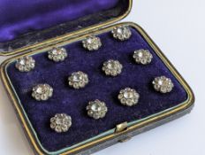 A cased set of twelve silver-backed shirt buttons with glass cluster decoration 