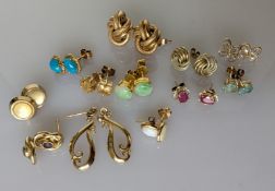 Twelve pairs of gold-backed earrings, two pairs without backs, mostly gem-set, 17g