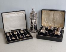 A late Victorian silver sugar shaker with turned finial, girdle to centre on a raised base, hallmark