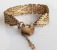 A yellow gold gate-link bracelet with padlock clasp, 15 cm, hallmarked 9ct, 31.5g