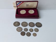 A cased United States Olympic Coins for Los Angeles1984, the two proof 900 fine silver coins each 26