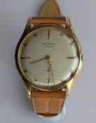 A vintage Rotary gentleman's manual wristwatch with baton markers in a 9ct gold case, hallmarked fo