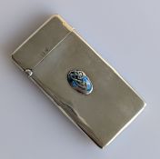 A Liberty & Co. Cymric silver card case of rectangular form with blue and green enamel motif