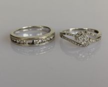 A white gold half-hoop eternity ring with channel-set diamond decoration on a tapering shank