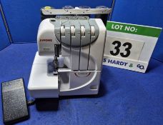 A JANOME 9300DX 4-Thread Overlocking Machine with Treadle Operation