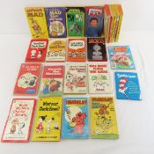 25 paperback Books, MAD, Charlie Brown & more