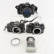 3 Nikon FG & EM 35mm Film Cameras & 100mm f/2.8
