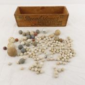 Collection of vintage China marbles in cheese box