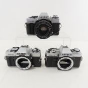 3 Minolta 35mm Film Cameras with lenses
