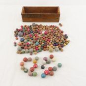 Collection of vintage Clay marbles in cheese box