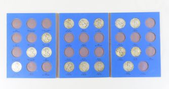 15 Walking Liberty Silver Half Dollars in book