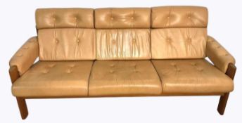 EKORNES; an 'Amigo' four piece tan leather and teak framed 1970s suite, comprising two three seat