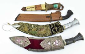 Various South Asian weapons comprising two Kothimora Gurkha kukri knives in ornate sheaths, length