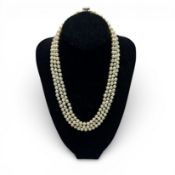 Triple strand pearl necklace with white gold clasp