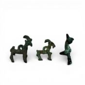 Three bronze sculptures, including two goat-shaped amulets, Luristan