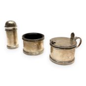 Silver mustard pot, salt cellar, and shaker