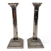 Pair of large silver column-shaped candlesticks