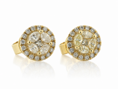 One princess cut diamond is surrounded by four fancy yellow marquise shaped diamond to create a
