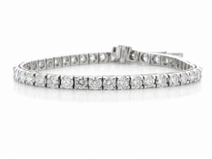 Forty one round brilliant cut diamonds are set in this stunning tennis bracelet. 7 inches in