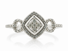 A cluster of four round brilliant cut diamonds are set in a diamond shaped cluster with a halo of