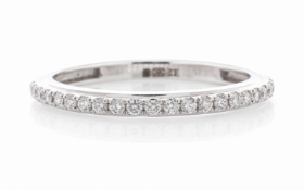This classic semi eternity diamond ring is set with twenty one round brilliant cut diamonds along