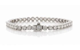 Forty round brilliant cut diamonds are set in this stunning tennis bracelet. 7 inches in length.Item