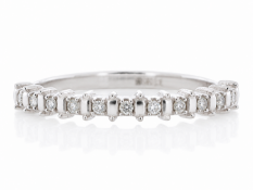 A twist on the classic semi eternity diamond ring, this ring has eleven round brilliant cut diamonds