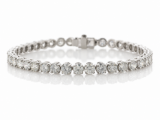 Forty round brilliant cut diamonds are set in this stunning 18ct white gold tennis bracelet. 7