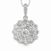 A central round brilliant cut diamond is surrounded by a cluster of eight round brilliant cut