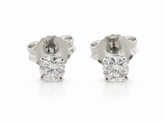 Two natural round brilliant cut diamonds are set in these classic diamonds stud earrings. approx.