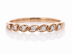 Seven round brilliant cut diamond are set along this charming semi eternity style diamond ring. Ring