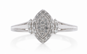 Thirteen single cut diamonds are set in a marquise shaped cluster, surrounded by a halo of