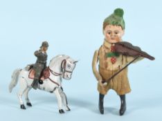 Schuco - Tanzfigur "Knabe mit Geige" und Tippco - Blechpferd mit Soldat