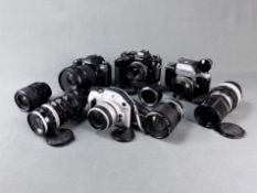 Konvolut von vier Nikon Kameras, bestehend aus F, FE 2, F 80 und Pronea S mit Objektiven: Nikon F m