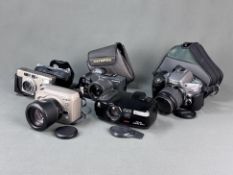 Konvolut von fünf Kameras, bestehend aus Nikon "Pronea 600i" mit 24-70mm-IX-Nikkor-Objektiv, Olympu