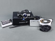 Kamera Konica Minolta Dimage X1 mit Ladeteil, Kabel, im Karton, dabei Minolta 110 Zoom SLR, Funktio