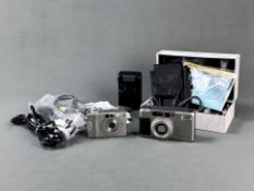 Konvolut 2 Digital-Kameras im Original Karton, bestehend aus Zeiss Contax T VS II mit Objektiv Vari