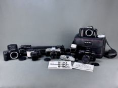 Konvolut von vier Kameras und Zubehör, bestehend aus Nikon F90 mit Nikon Nikkor Objektiv, Nikon F-4