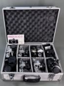 Minolta-Konvolut, 2 Kameragehäuse Minolta XG2, XG9, 4 Minolta Kameras; Minolta SFT 303 mit MC Rokko