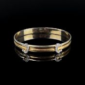 Cartier Armreif, 750/18K Gelb- und Weißgold (punziert), Gesamtgewicht 18,7g, nummeriert 416519, ges
