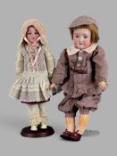 Zwei Puppen, Schönau & Hoffmeister, bestehend aus Puppenmädchen, am Hinterkopf bezeichnet "Germany