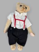 Steiff Teddy um 1909, mit Buckel, Mohair, Körper mit Stroh gefüllt, Glasaugen, bewegliche Glieder u