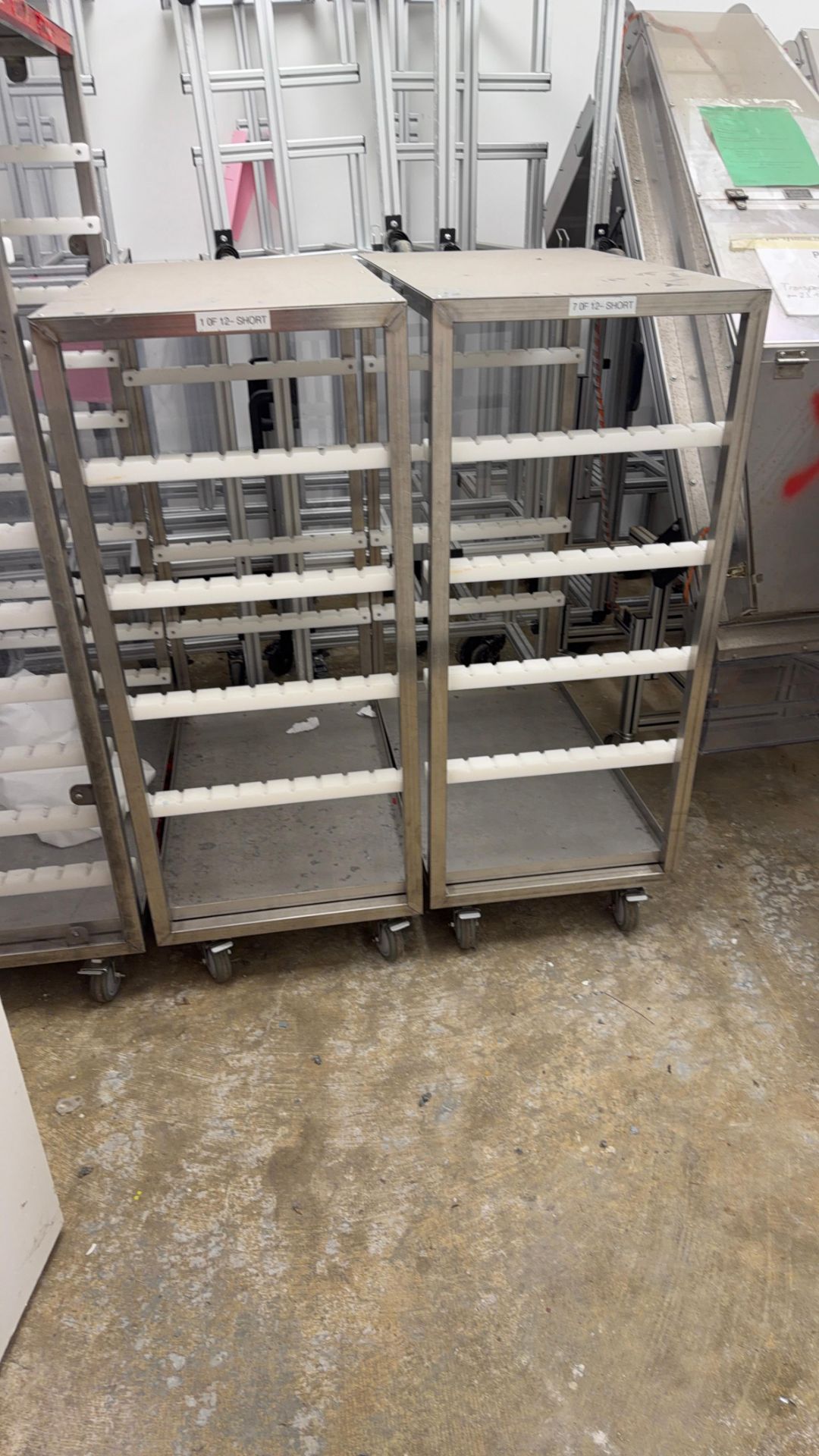 Stainless Steel Ridged Rack Pair of stainless steel rolling racks with plastic rail supports ...