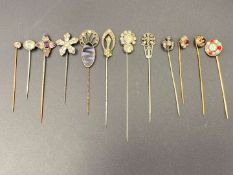 TWELVE VARIOUS GILT, WHITE METAL AND PASTE SET STICK PINS