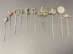 TEN VARIOUS SILVER AND BASE METAL STICK PINS