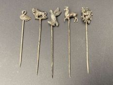 FIVE VARIOUS SILVER AND BASE METAL STICK PINS
